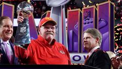 (FILES) Kansas City Chiefs' head coach Andy Reid (C) holds the trophy next to Kansas City Chiefs' owner, chairman and CEO Clark Hunt (R) as they celebrate winning Super Bowl LVIII against the San Francisco 49ers at Allegiant Stadium in Las Vegas, Nevada, February 11, 2024. Kansas City Chiefs head coach Andy Reid, general manager Brett Veach and team president Mark Donovan have received long-term contract extensions, the reigning Super Bowl champions announced on the night of April 22, 2024. (Photo by TIMOTHY A. CLARY / AFP)