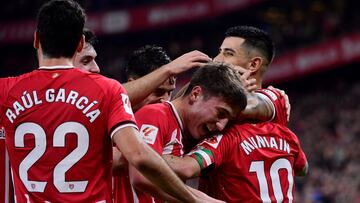 Athletic Bilbao's Spanish forward #10 Iker Muniain celebrates with teammates scoring his team's fourth goal during the Spanish league football match between Athletic Club Bilbao and RCD Mallorca at the San Mames stadium in Bilbao on February 2, 2024. (Photo by Ander Gillenea / AFP)