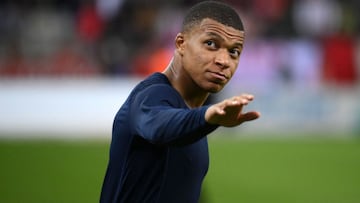 Paris Saint-Germain's French forward Kylian Mbappe reacts during the French L1 football match between Stade de Reims and Paris Saint-Germain at Auguste Delaune Stadium in Reims on August 29, 2021. (Photo by FRANCK FIFE / AFP)