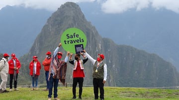 Japanese tourist Jesse Katayama (C) attends a small ceremony with Mayor of the Machupicchu district Darwin Baca (L) and Regional Governor of Cusco Jean Paul Benavente, after becoming the first tourist to visit the Inca citadel during the coronavirus disease (COVID-19) pandemic, in Machu Picchu, Peru October 13, 2020.  Municipality of Machu Picchu/Handout via REUTERS ATTENTION EDITORS - THIS IMAGE WAS PROVIDED BY A THIRD PARTY