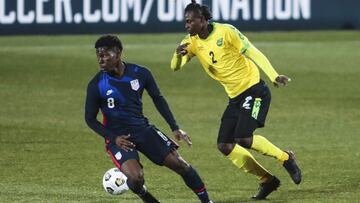 USA&#039;s Yunus Musah, left, duels for the ball with Jamaica&#039;s Chavany Willis during the international friendly soccer match between USA and Jamaica at SC Wiener Neustadt stadium in Wiener Neustadt, Austria, Thursday, March 25, 2021. (AP Photo/Ronal