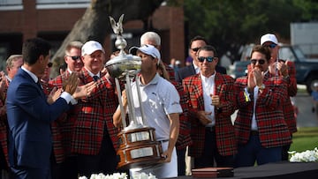 Emiliano Grillo of Argentina kisses the trophy after winning the Charles Schwab Challenge