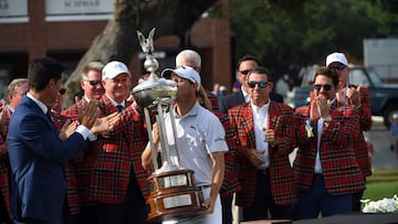 Emiliano Grillo of Argentina kisses the trophy after winning the Charles Schwab Challenge