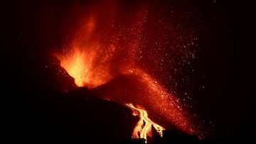 The Cumbre Vieja volcano spews lava and smoke as it continues to erupt on the Canary Island of La Palma, as seen from El Paso, Spain, 