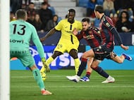 Villarreal's Ivorian forward #19 Nicolas Pepe, Levante's Spanish defender #06 Diego Pampin (2R) and Levante's Argentine defender #02 Matias Agustin Moreno (R) fight for the ball during the Spanish league football match between Levante UD and Villarreal CF at Ciutat de Valencia Stadium in Valencia on February 18, 2026. (Photo by JOSE JORDAN / AFP)