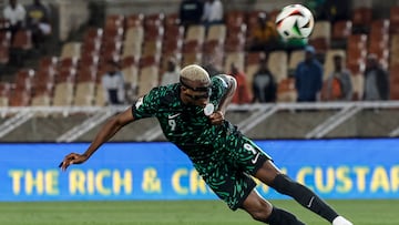 Nigeria's forward #9 Victor Osimhen heads the ball but fails to score during the FIFA World Cup 2026 Africa qualifiers group C match between Lesotho and Nigeria at the Peter Mokaba Stadium in Polokwane on October 10, 2025. (Photo by PHILL MAGAKOE / AFP) / ALTERNATE CROP