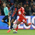 Paris Saint-Germain's French forward #10 Ousmane Dembele (L) and Brest's Malian defender #22 Massadio Haidara (R) fight for the ball during the French L1 football match between Paris Saint-Germain (PSG) and Stade Brestois 29 (Brest) at The Parc des Princes Stadium, in Paris, on September 14, 2024. (Photo by GEOFFROY VAN DER HASSELT / AFP)