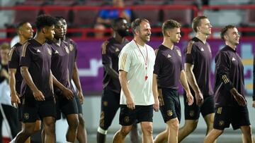 Soccer Football - FIFA World Cup Qatar 2022 - Germany Training - Al Shamal Stadium, Al Shamal, Qatar - November 30, 2022 Germany coach Hansi Flick with teammates during training REUTERS/Annegret Hilse