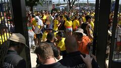 Security personnel detain Colombia's supporters that tried to get into the stadium without tickets ahead of the Conmebol 2024 Copa America tournament final football match between Argentina and Colombia at the Hard Rock Stadium, in Miami, Florida on July 14, 2024. (Photo by JUAN MABROMATA / AFP)