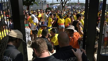 Security personnel detain Colombia's supporters that tried to get into the stadium without tickets ahead of the Conmebol 2024 Copa America tournament final football match between Argentina and Colombia at the Hard Rock Stadium, in Miami, Florida on July 14, 2024. (Photo by JUAN MABROMATA / AFP)