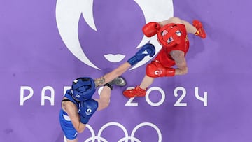 Paris 2024 Olympics - Boxing - Women's 57kg - Prelims - Round of 32 - North Paris Arena, Villepinte, France - July 30, 2024. Irma Testa of Italy in action against Zichun Xu of China. Richard Pelham/Pool via REUTERS