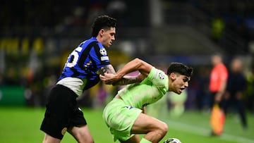 Barcelona's Spanish defender #35 Gerard Martin (R) and Inter Milan's Italian defender #95 Alessandro Bastoni fight for the ball during the UEFA Champions League semi-final second leg football match between Inter Milan and FC Barcelona at the San Siro stadium in Milan on May 6, 2025. (Photo by Marco BERTORELLO / AFP)