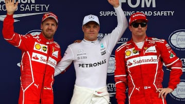 SAO PAULO, BRAZIL - NOVEMBER 11:  Top three qualifiers Valtteri Bottas of Finland and Mercedes GP, Sebastian Vettel of Germany and Ferrari and Kimi Raikkonen of Finland and Ferrari celebrate in parc ferme during qualifying for the Formula One Grand Prix of Brazil at Autodromo Jose Carlos Pace on November 11, 2017 in Sao Paulo, Brazil.  (Photo by Mark Thompson/Getty Images)