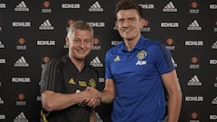 MANCHESTER, ENGLAND - AUGUST 04: (EXCLUSIVE COVERAGE) Harry Maguire of Manchester United poses with Manager Ole Gunnar Solskjaer after signing for the club at Aon Training Complex on August 04, 2019 in Manchester, England. (Photo by Manchester United/Manc