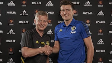 MANCHESTER, ENGLAND - AUGUST 04: (EXCLUSIVE COVERAGE) Harry Maguire of Manchester United poses with Manager Ole Gunnar Solskjaer after signing for the club at Aon Training Complex on August 04, 2019 in Manchester, England. (Photo by Manchester United/Manc