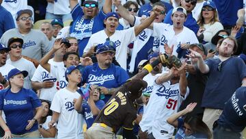 Oct 6, 2024; Los Angeles, California, USA; San Diego Padres outfielder Jurickson Profar (10) catches a ball hit by Los Angeles Dodgers shortstop Mookie Betts (50) in the first inning during game two of the NLDS for the 2024 MLB Playoffs at Dodger Stadium. Mandatory Credit: Kiyoshi Mio-Imagn Images