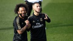 Marcelo, player of Real Madrid from Brazil, and Eden Hazard, player of Real Madrid from Belgium, smiles during the Real Madrid training day before the spanish league La Liga football match between Real Madrid CF and Real Betis Balompie in Valdebebas, Madr