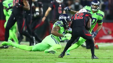 Nov 9, 2017; Glendale, AZ, USA; Seattle Seahawks cornerback Richard Sherman (25) ruptured his Achilles tendon as he tackles Arizona Cardinals wide receiver John Brown (12) in the second half at University of Phoenix Stadium. Mandatory Credit: Mark J. Rebilas-USA TODAY Sports