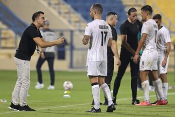 Qatari football club al-Sadd SC's Spanish coach Xavi Hernandez gestures during Qatar Stars League match between al-Sadd SC and al-Duhail SC, at Thani Bin Jassim Stadium (Al-Gharafah Stadium) in Qatar's capital Doha on November 3, 2021. (Photo by KARIM JAA