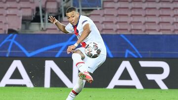 Paris Saint-Germain's French forward Kylian Mbappe scores a goal during the UEFA Champions League round of 16 first leg football match between FC Barcelona and Paris Saint-Germain FC at the Camp Nou stadium in Barcelona on February 16, 2021. (Photo b