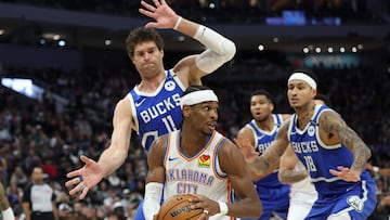 Shai Gilgeous-Alexander #2 of the Oklahoma City Thunder is defended by Brook Lopez #11 of the Milwaukee Bucks during the first half of a game at Fiserv Forum on March 16, 2025 in Milwaukee, Wisconsin.