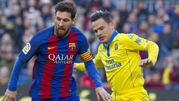 Roque Mesa y Lionel Messi.