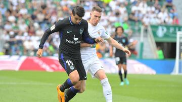 Atletico Madrid's Spanish forward Alvaro Morata (L) vies with Elche's Spanish defender Carlos Clerc during the Spanish league football match between Elche CF and Club Atletico de Madrid at the Martinez Valero stadium in Elche on May 14, 2023. (Photo by Jose Jordan / AFP)