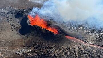 FILE PHOTO: Lava spurts and flows after the eruption of a volcano in the Reykjanes Peninsula, Iceland, July 12, 2023, as seen in this handout picture taken from a Coast Guard helicopter. Civil Protection of Iceland/Handout via REUTERS    THIS IMAGE HAS BEEN SUPPLIED BY A THIRD PARTY. MANDATORY CREDIT/File Photo