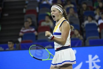 Jelena Ostapenko reacts after winning a big point against Maria Garbine Muguruza.