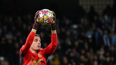 Real Madrid's Ukrainian goalkeeper #13 Andriy Lunin jumps during the UEFA Champions League quarter-final second-leg football match between Manchester City and Real Madrid, at the Etihad Stadium, in Manchester, north-west England, on April 17, 2024. (Photo by Paul ELLIS / AFP)