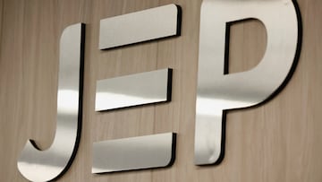 The logo of the Special Jurisdiction for Peace (JEP) hangs on a wall during the reading of the sentences against 12 former soldiers for their role in extrajudicial executions, in Bogota, Colombia September 18, 2025. REUTERS/Luisa Gonzalez