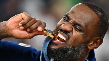 Gold medallist USA's #06 LeBron James poses on the podium after the men's Gold Medal basketball match between France and USA during the Paris 2024 Olympic Games at the Bercy Arena in Paris on August 10, 2024. (Photo by Aris MESSINIS / AFP)