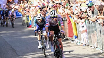 UAE Team Emirates team's Slovenian rider Tadej Pogacar (R) and Team Visma - Lease a Bike team's Danish rider Jonas Vingegaard cycle up the San Luca ascent near Bologna in the final kilometers of the 2nd stage of the 111th edition of the Tour de France cycling race, 199 km between Cesenatico and Bologna, in Italy, on June 30, 2024. (Photo by Bernard PAPON / POOL / AFP)