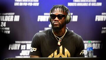 Boxer Deontay Wilder looks on without taking questions during a press conference with  Tyson Fury on June 15, 2021 in Los Angeles, California to announce their third WBC heavyweight championship ficght scheduled for July 24 in las Vegas. (Photo by Frederic J. BROWN / AFP)