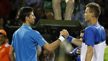 Novak Djokovic and Tomas Berdych shake hands at the net.