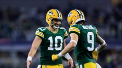 ARLINGTON, TEXAS - JANUARY 14: Jordan Love #10 of the Green Bay Packers celebrates with Christian Watson #9 during the second half of the NFC Wild Card Playoff game against the Dallas Cowboys at AT&T Stadium on January 14, 2024 in Arlington, Texas.   Ron Jenkins/Getty Images/AFP (Photo by Ron Jenkins / GETTY IMAGES NORTH AMERICA / Getty Images via AFP)