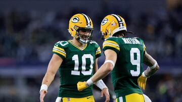 ARLINGTON, TEXAS - JANUARY 14: Jordan Love #10 of the Green Bay Packers celebrates with Christian Watson #9 during the second half of the NFC Wild Card Playoff game against the Dallas Cowboys at AT&T Stadium on January 14, 2024 in Arlington, Texas.   Ron Jenkins/Getty Images/AFP (Photo by Ron Jenkins / GETTY IMAGES NORTH AMERICA / Getty Images via AFP)