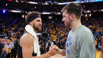 Dallas Mavericks guard Luka Doncic with Golden State Warriors guard Klay Thompson after game five of the 2022 western conference finals at Chase Center.