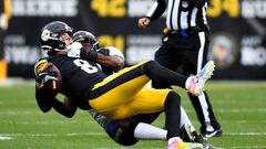 PITTSBURGH, PENNSYLVANIA - DECEMBER 11: Kenny Pickett #8 of the Pittsburgh Steelers	is sacked by Roquan Smith #18 of the Baltimore Ravens in the first quarter of the game at Acrisure Stadium on December 11, 2022 in Pittsburgh, Pennsylvania. (Photo by Joe Sargent/Getty Images)