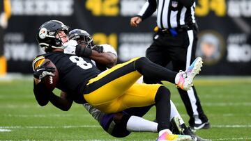 PITTSBURGH, PENNSYLVANIA - DECEMBER 11: Kenny Pickett #8 of the Pittsburgh Steelers	is sacked by Roquan Smith #18 of the Baltimore Ravens in the first quarter of the game at Acrisure Stadium on December 11, 2022 in Pittsburgh, Pennsylvania. (Photo by Joe Sargent/Getty Images)