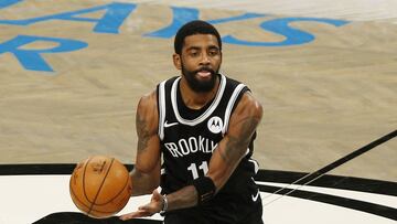 Jan 5, 2021; Brooklyn, New York, USA; Brooklyn Nets guard Kyrie Irving (11) dribbles the ball against the Utah Jazz  during the first half at Barclays Center. Mandatory Credit: Andy Marlin-USA TODAY Sports