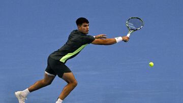 Spain's Carlos Alcaraz hits a return against Germany's Yannick Hanfmann in their men's singles match during the China Open tennis tournament at the National Tennis Center in Beijing on September 29, 2023. (Photo by Pedro PARDO / AFP)