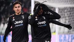 Juventus&#039; Italian forward Moise Kean (C) celebrates next to Juventus&#039; Argentine forward Paulo Dybala after opening the scoring during the UEFA Champions League Group H football match between Juventus and Malmo on December 8, 2021 at the Juventus