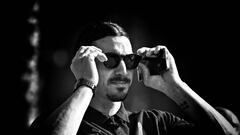 DUBAI, UNITED ARAB EMIRATES - DECEMBER 12:  (EDITORS NOTE: Image has been converted to black and white.) Zlatan Ibrahimovic of AC Milan looks on before the AC Milan press conference on December 12, 2022 in Dubai, United Arab Emirates. (Photo by Claudio Villa/AC Milan via Getty Images)