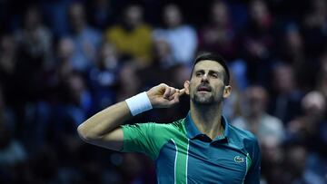 Serbia's Novak Djokovic reacts during the first round-robin match against Denmark's Holger Rune at the ATP Finals tennis tournament in Turin on November 12, 2023. (Photo by Tiziana FABI / AFP)