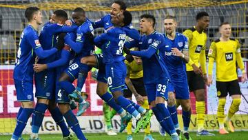 Leverkusen&#039;s German defender Jonathan Tah (3L) celebrates with teammates scoring his team&#039;s fourth goal with Leverkusen&#039;s Dutch defender Mitchel Bakker during the German first division Bundesliga football match between Borussia Dortmund and