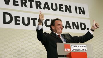 German Chancellor Gerhard Schroeder gives thumbs-up to supporters after first exit polls in Germany's general election at the SPD party headquarters in Berlin September 18, 2005. Voters appeared to have forced Germany's main political rivals int