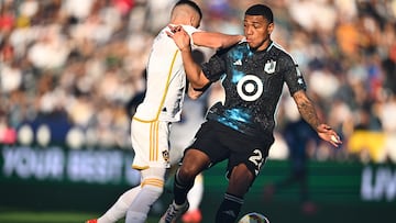 Nov 24, 2024; Carson, California, USA; Minnesota United goalkeeper Jefferson Diaz (28) kicks the ball past LA Galaxy forward Dejan Joveljic (9) during the first half in a 2024 MLS Cup conference semifinal match at Dignity Health Sports Park. Mandatory Credit: Kelvin Kuo-Imagn Images