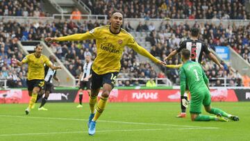 NEWCASTLE UPON TYNE, ENGLAND - AUGUST 11: Pierre-Emerick Aubameyang of Arsenal celebrates after scoring his team&#039;s first goal during the Premier League match between Newcastle United and Arsenal FC at St. James Park on August 11, 2019 in Newcastle up
