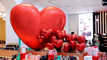 PARIS, FRANCE - FEBRUARY 13: Red hearts are displayed at the entrance of the Printemps Haussmann department store on the eve of Valentine's Day on February 13, 2023 in Paris, France. Valentine's Day is known as the feast of lovers and the celebration of love and romance in many parts of the world and takes place on February 14 each year. (Photo by Chesnot/Getty Images)